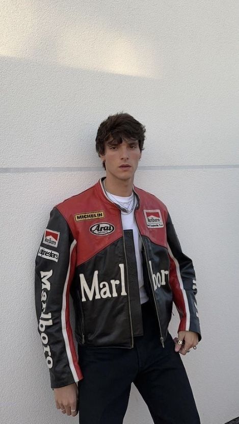 Person wearing a Marlboro branded leather jacket against a white wall